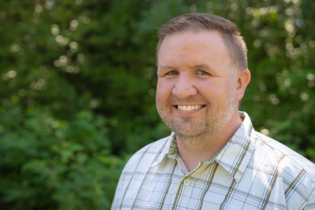 Headshot of a handsome thirty-something man